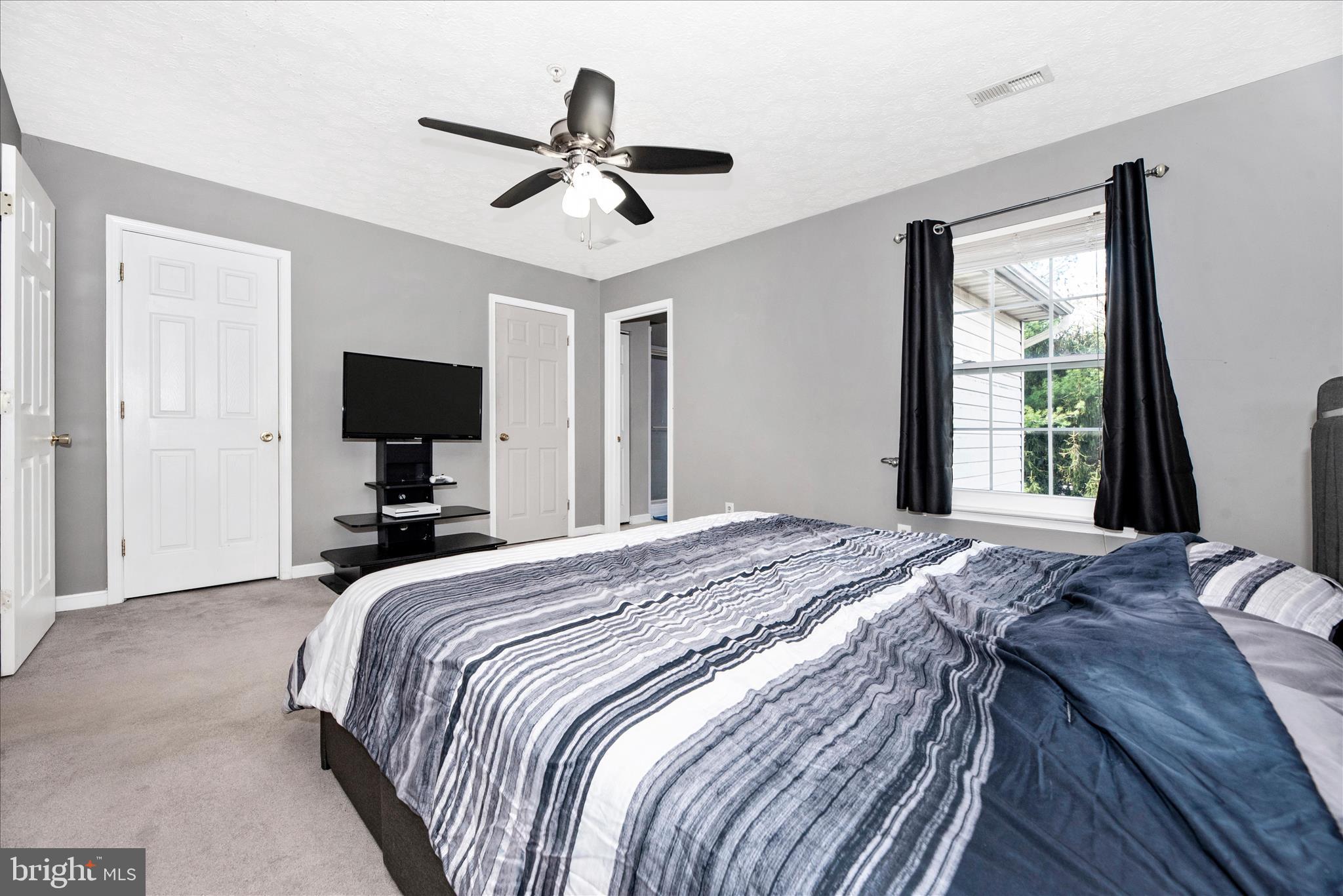1422 Roman Ridge Way Bel Air, MD 21014 - Photo 26 of 57 a bedroom with a bed and a flat screen tv