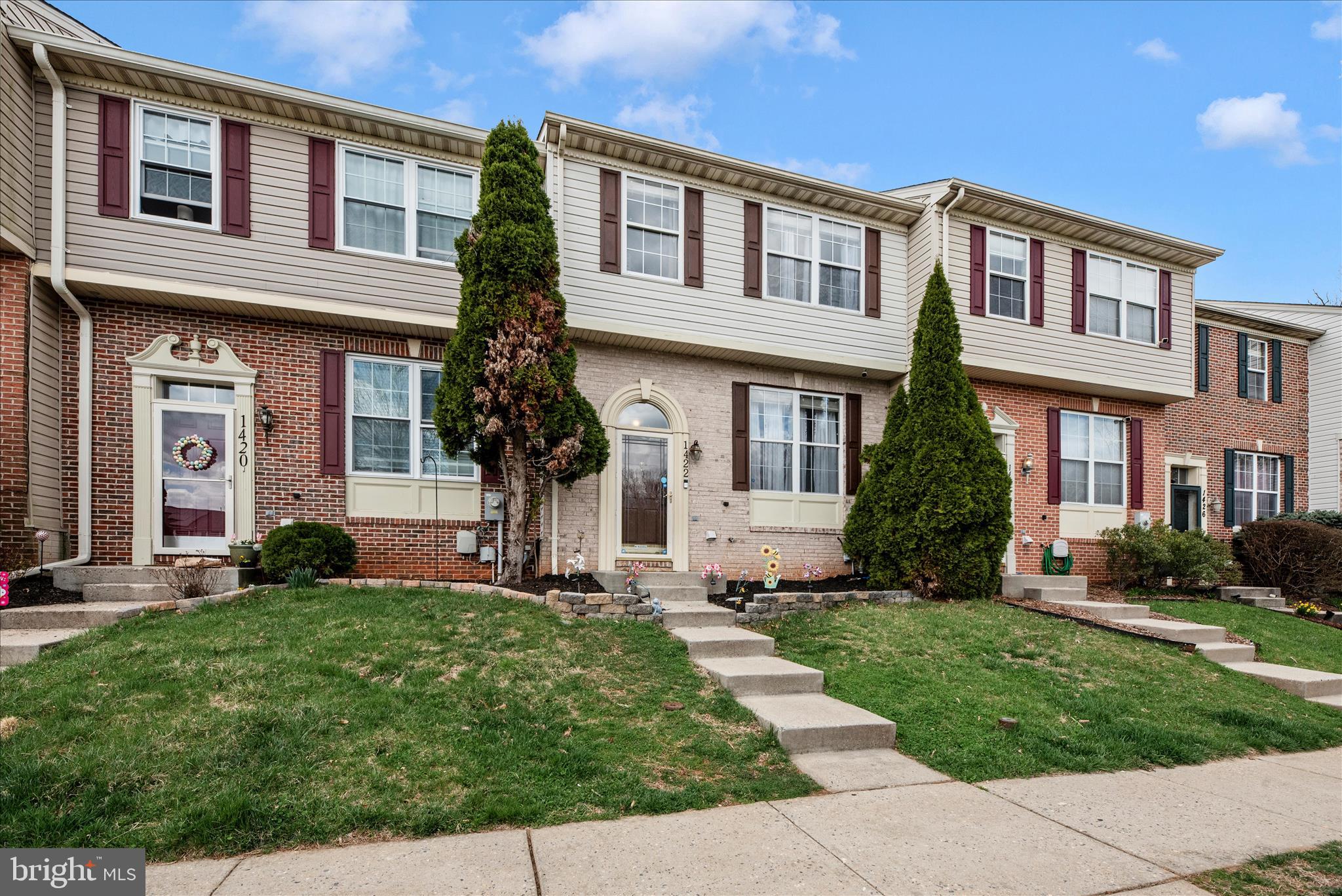 1422 Roman Ridge Way Bel Air, MD 21014 - Photo 54 of 57 front view of a brick house with a yard