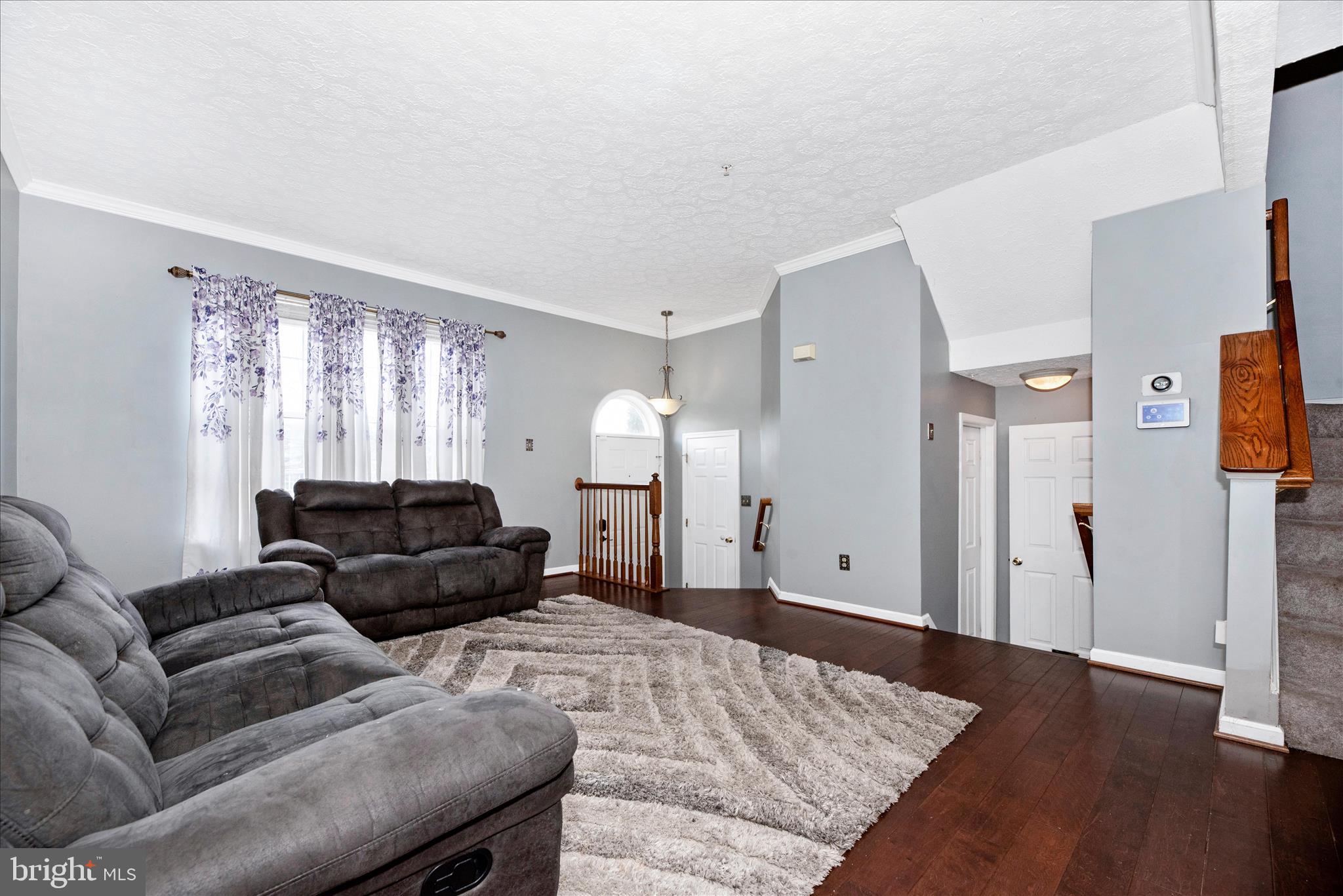 1422 Roman Ridge Way Bel Air, MD 21014 - Photo 7 of 57 a living room with furniture and a rug