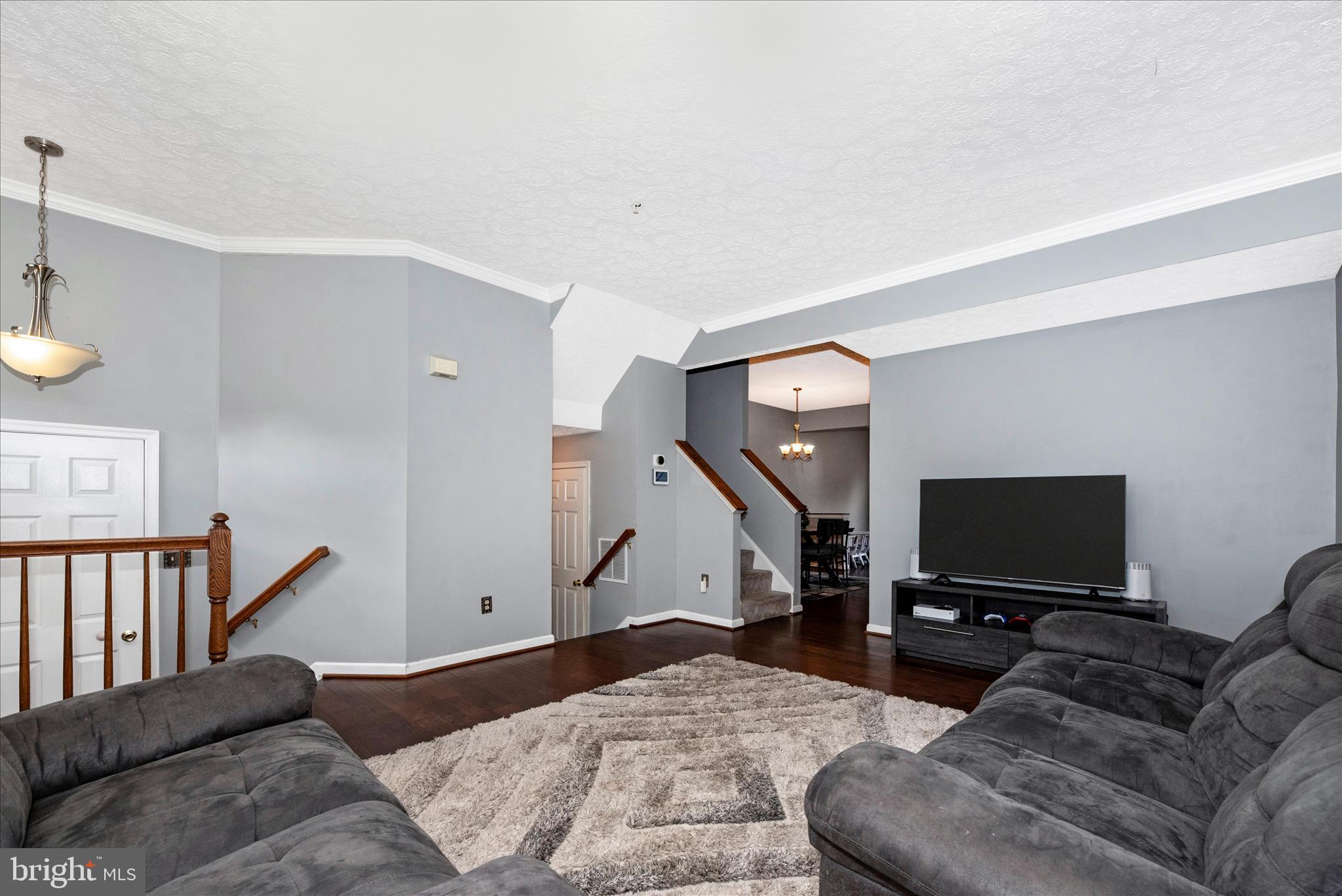 1422 Roman Ridge Way Bel Air, MD 21014 - Photo 8 of 57 a living room with furniture and a flat screen tv