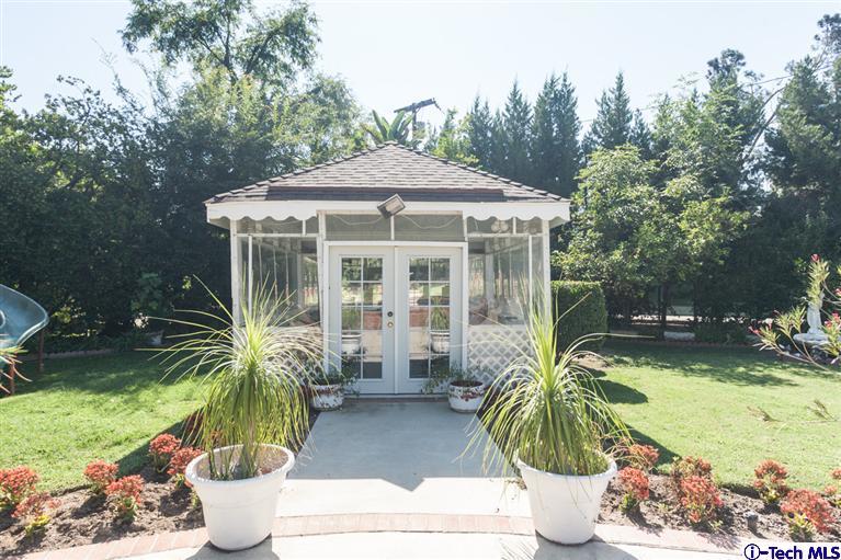 Undisclosed Address Pasadena, CA 91107 - Photo 15 of 16 a potted plant sitting in front of a house