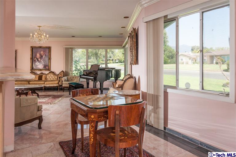 Undisclosed Address Pasadena, CA 91107 - Photo 3 of 16 a dining room with furniture a large window and a rug