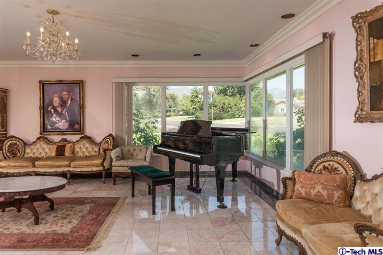 Undisclosed Address Pasadena, CA 91107 - Photo 4 of 16 a living room with furniture a table and large windows