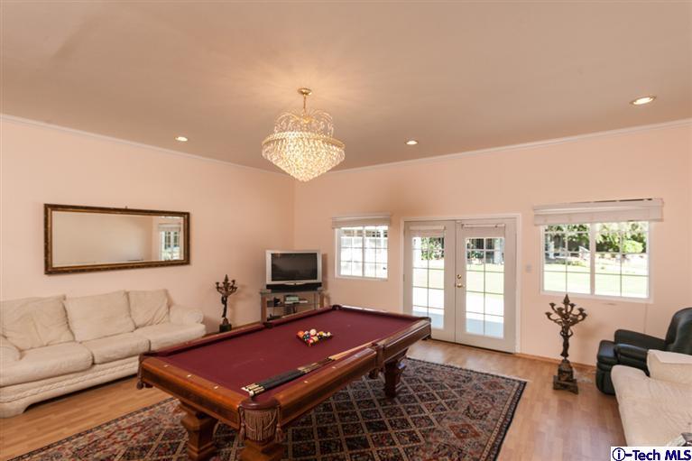 Undisclosed Address Pasadena, CA 91107 - Photo 6 of 16 a living room with furniture a flat screen tv and a large window