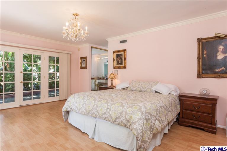 Undisclosed Address Pasadena, CA 91107 - Photo 10 of 16 a spacious bedroom with a bed and a flat screen tv