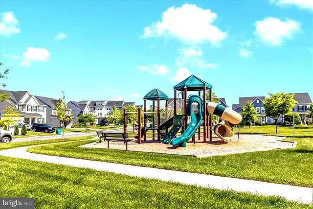a view of a park with swings and slides
