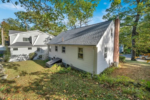 a view of a house with a porch and wooden floor