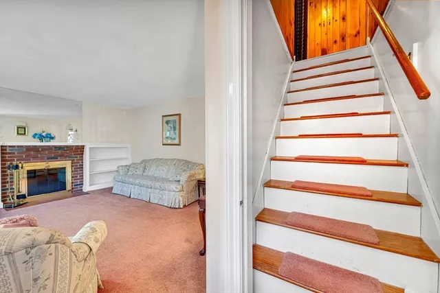 a bedroom with a bed and a fireplace