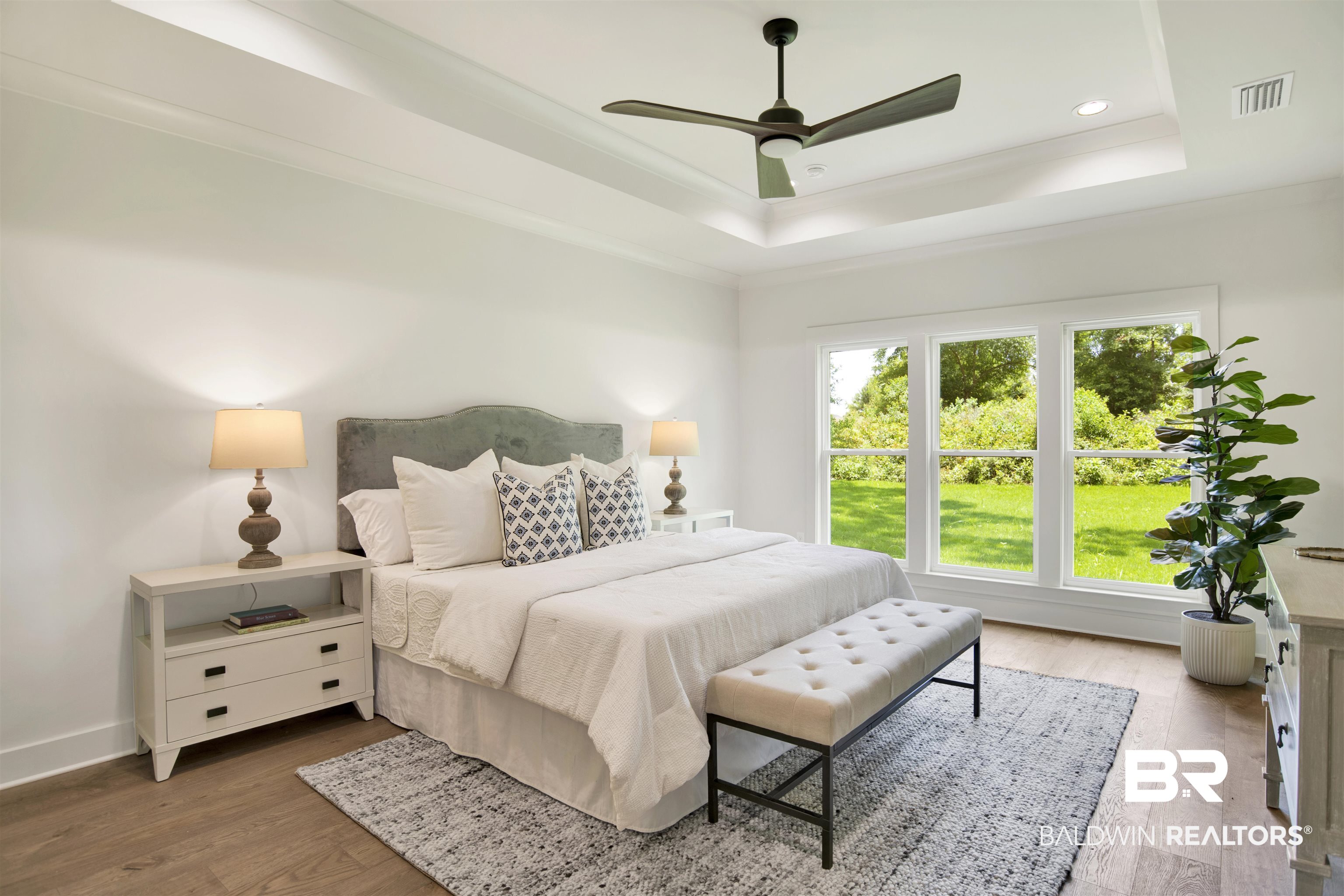 9275 Clarke Ridge Road Foley, AL 36535 - Photo 22 of 43 Bedroom with a raised ceiling, wood finished floors, baseboards, ceiling fan, and recessed lighting