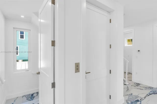 a bathroom with a toilet sink vanity and mirror