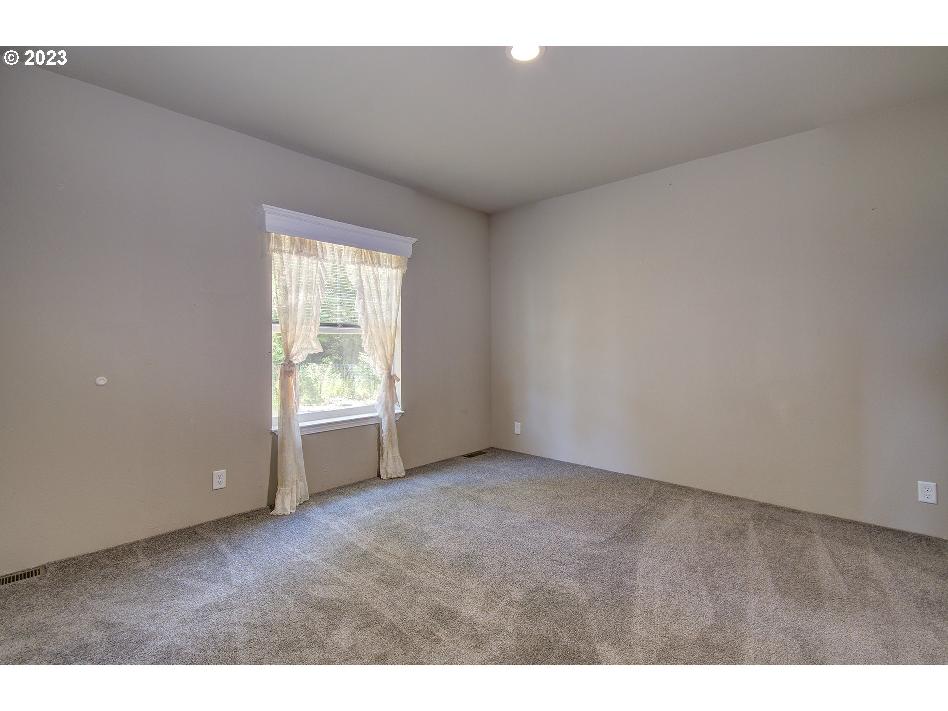 136 Stringtown Road Ilwaco, WA 98624 - Photo 29 of 47 a view of an empty room with a window