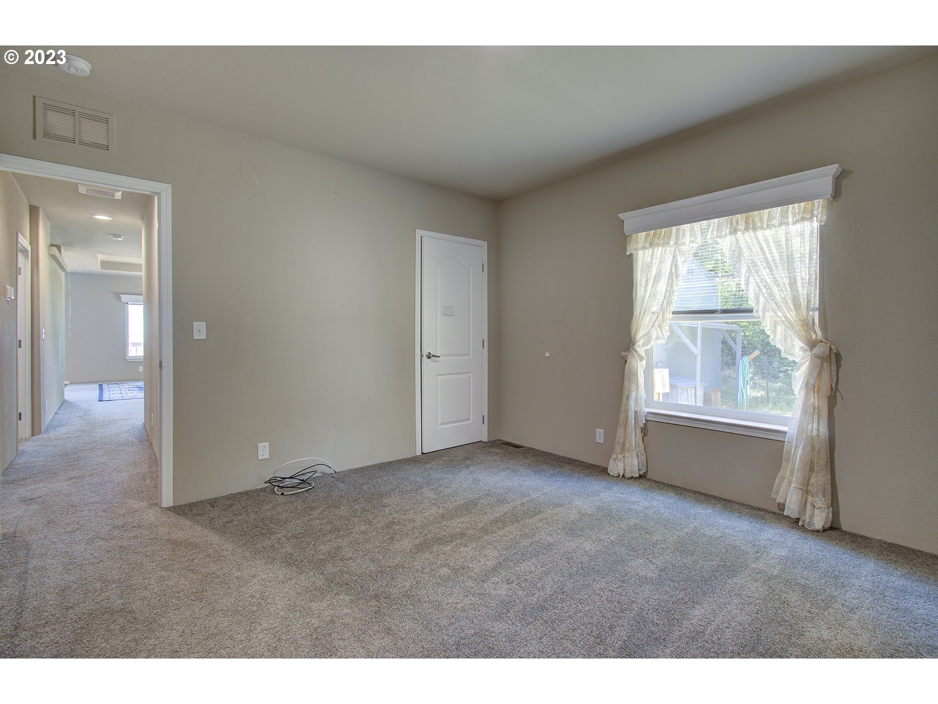 136 Stringtown Road Ilwaco, WA 98624 - Photo 32 of 47 a view of an empty room with a window