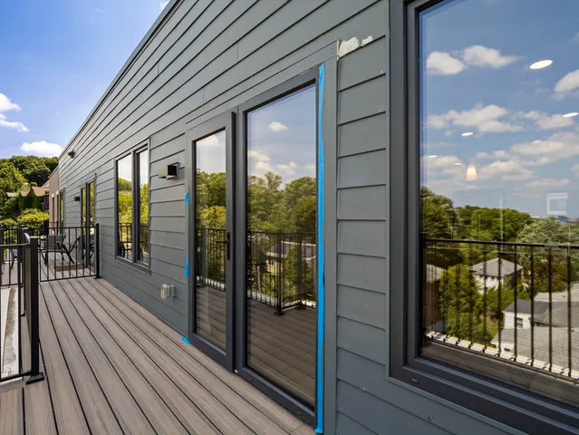 a view of a balcony with wooden floor