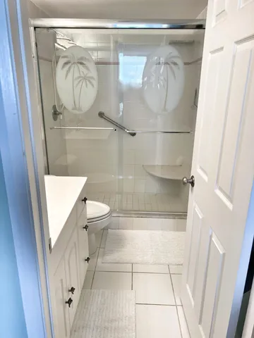 a bedroom with a bed and cabinets