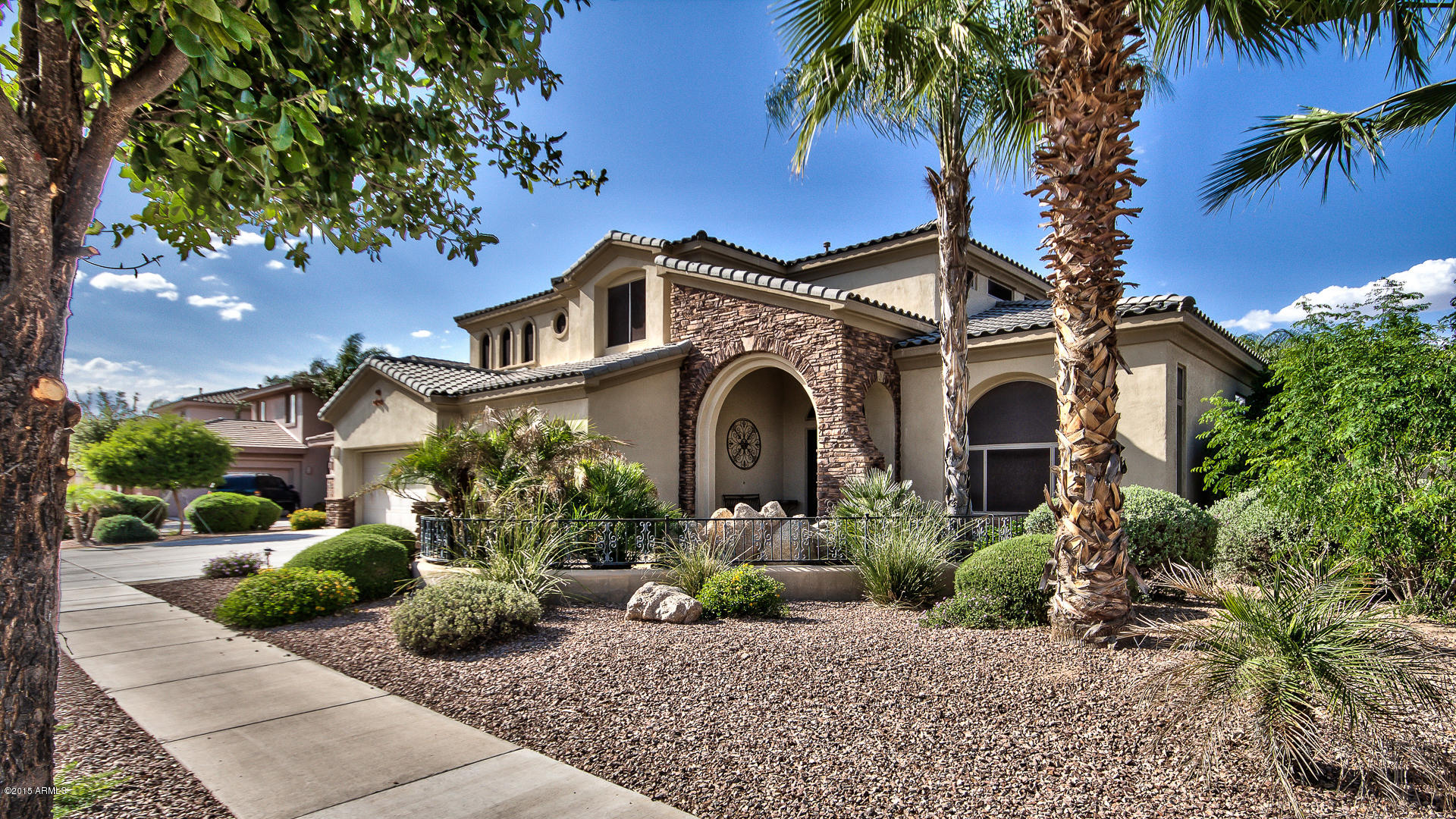 4782 East Buckboard Road Gilbert, AZ 85297 - Photo 1 of 57 a front view of a house with a garden