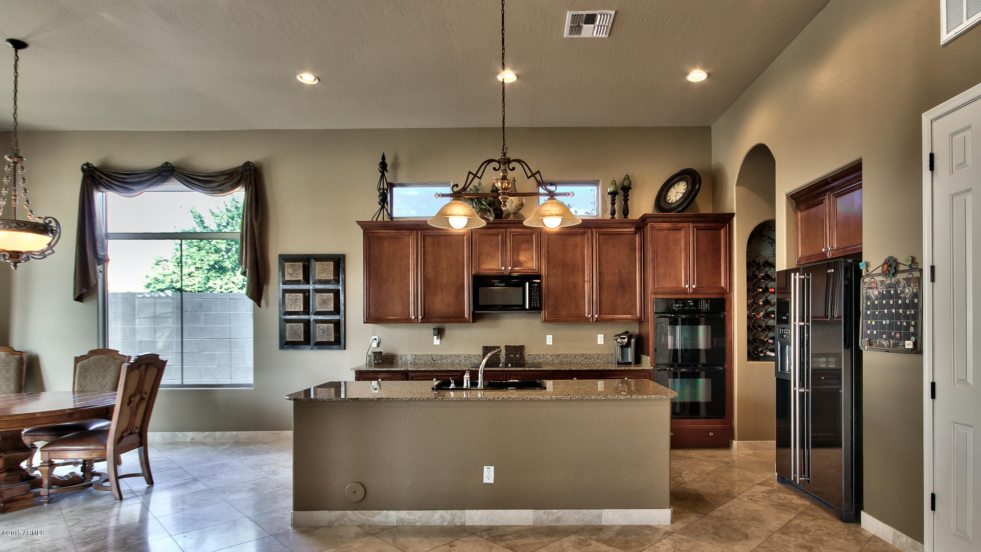 4782 East Buckboard Road Gilbert, AZ 85297 - Photo 15 of 57 a living room with couches and kitchen view with wooden floor
