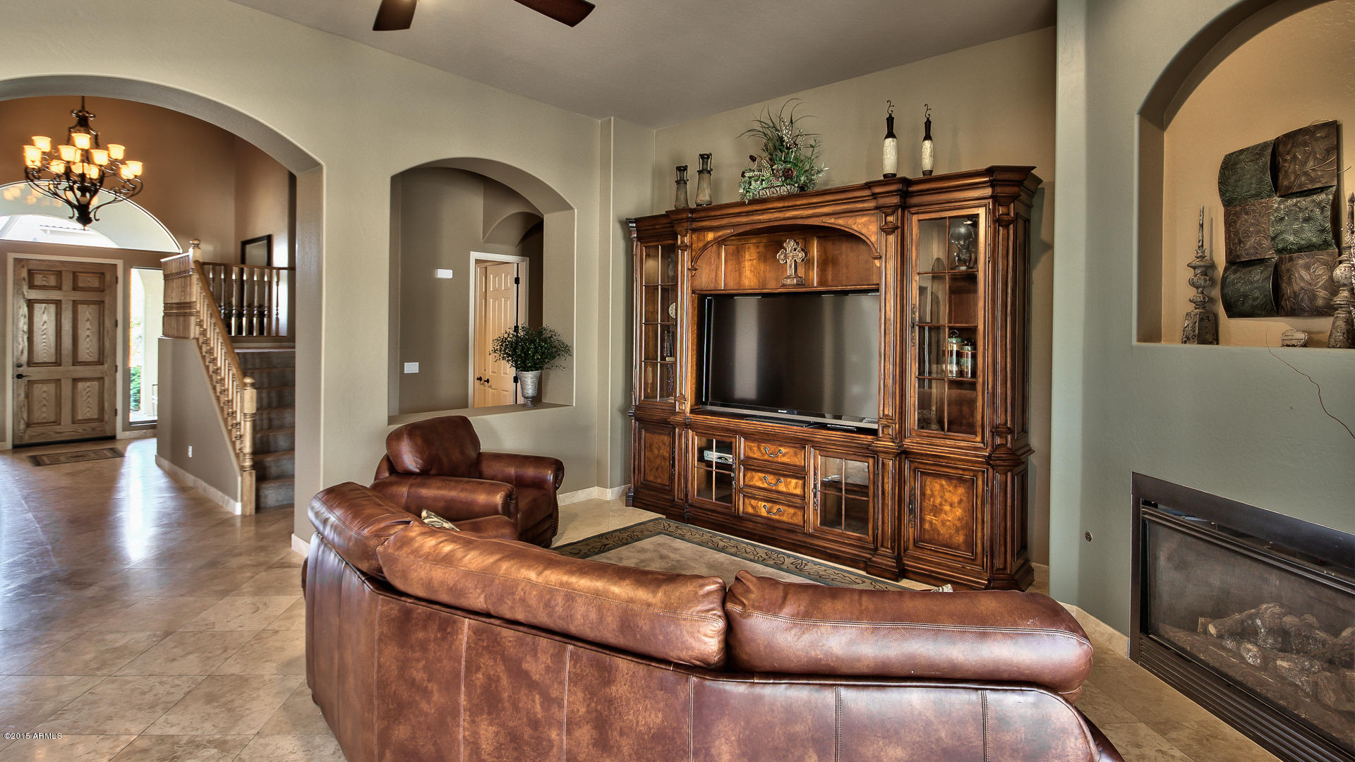 4782 East Buckboard Road Gilbert, AZ 85297 - Photo 16 of 57 a living room with furniture and a flat screen tv