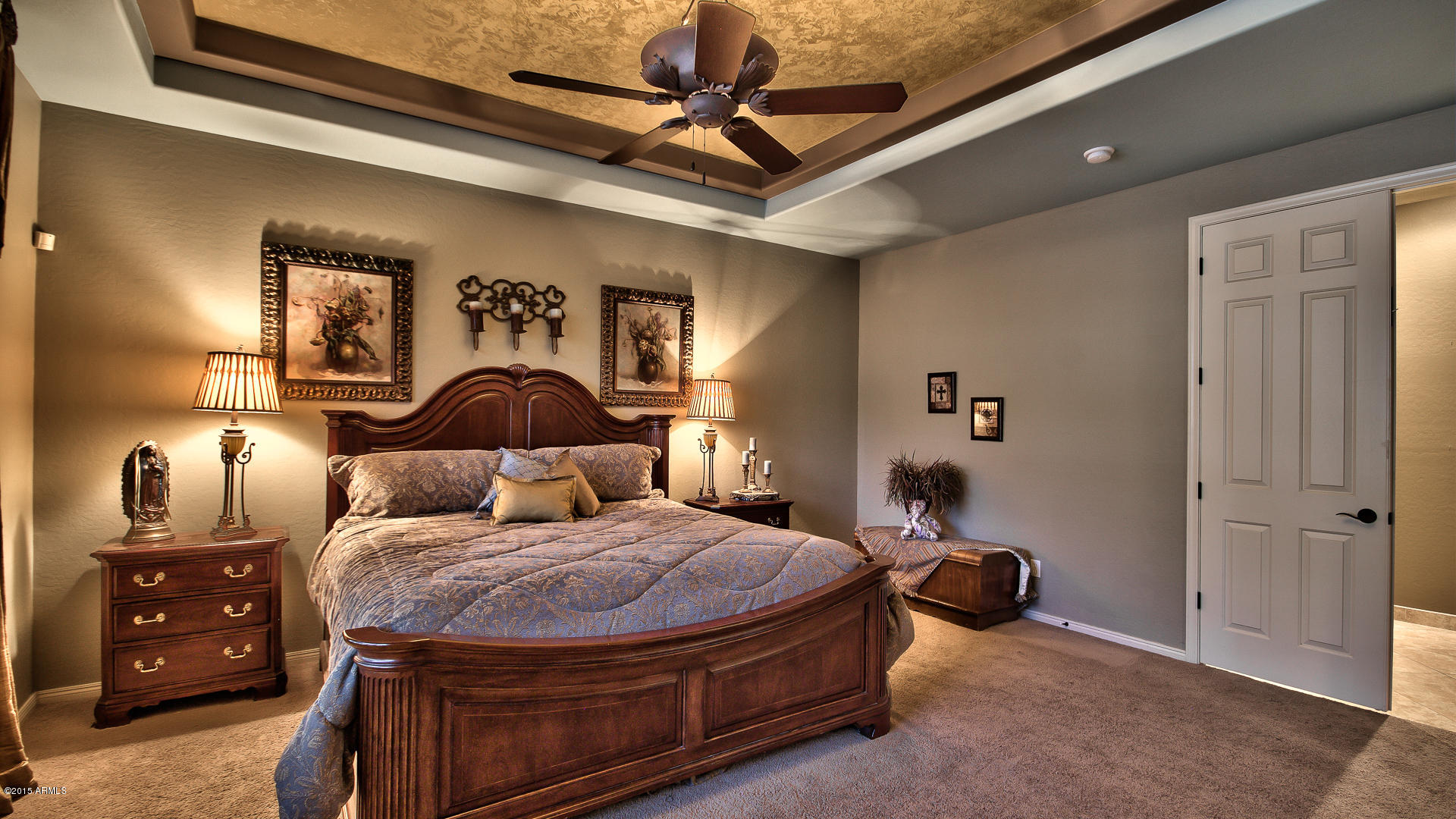 4782 East Buckboard Road Gilbert, AZ 85297 - Photo 19 of 57 a bedroom with a bed and a chandelier