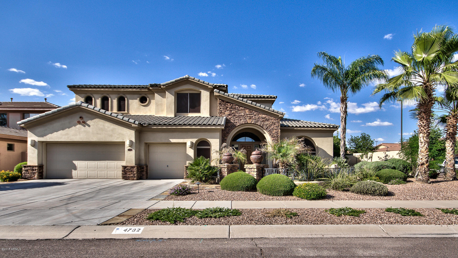 4782 East Buckboard Road Gilbert, AZ 85297 - Photo 2 of 57 a front view of a house with a yard