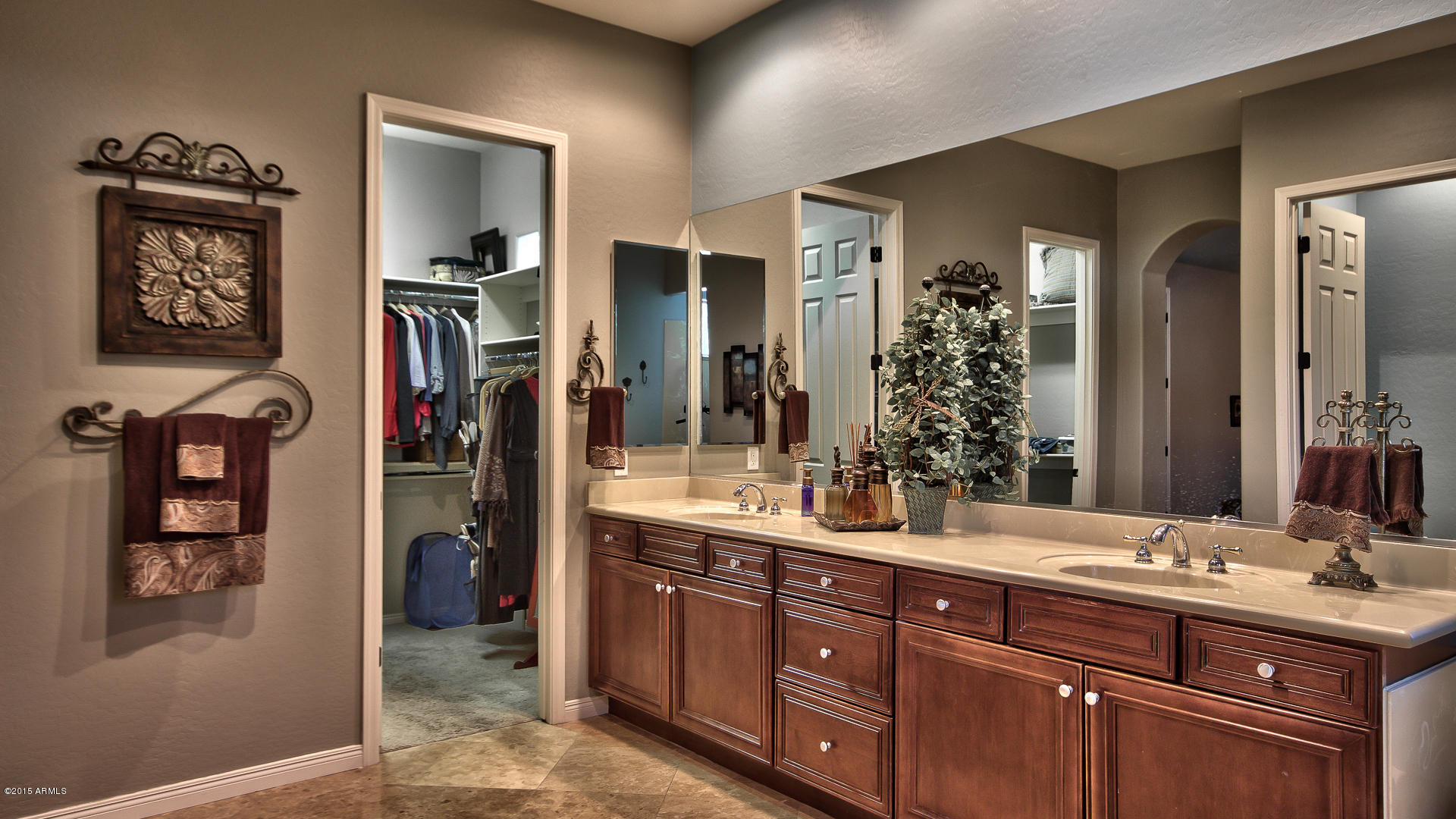 4782 East Buckboard Road Gilbert, AZ 85297 - Photo 21 of 57 a bathroom with double vanity sinks and a shower