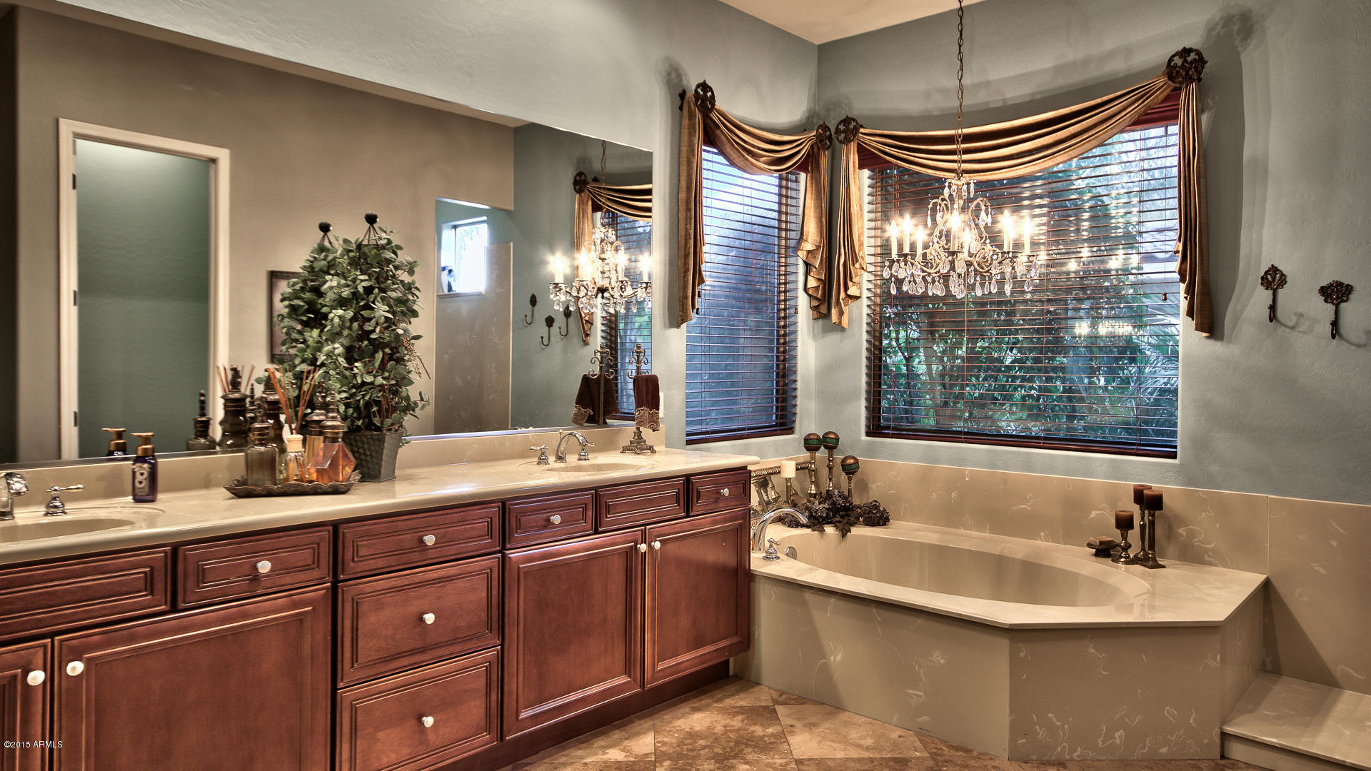 4782 East Buckboard Road Gilbert, AZ 85297 - Photo 22 of 57 a bathroom with double vanity and a mirror