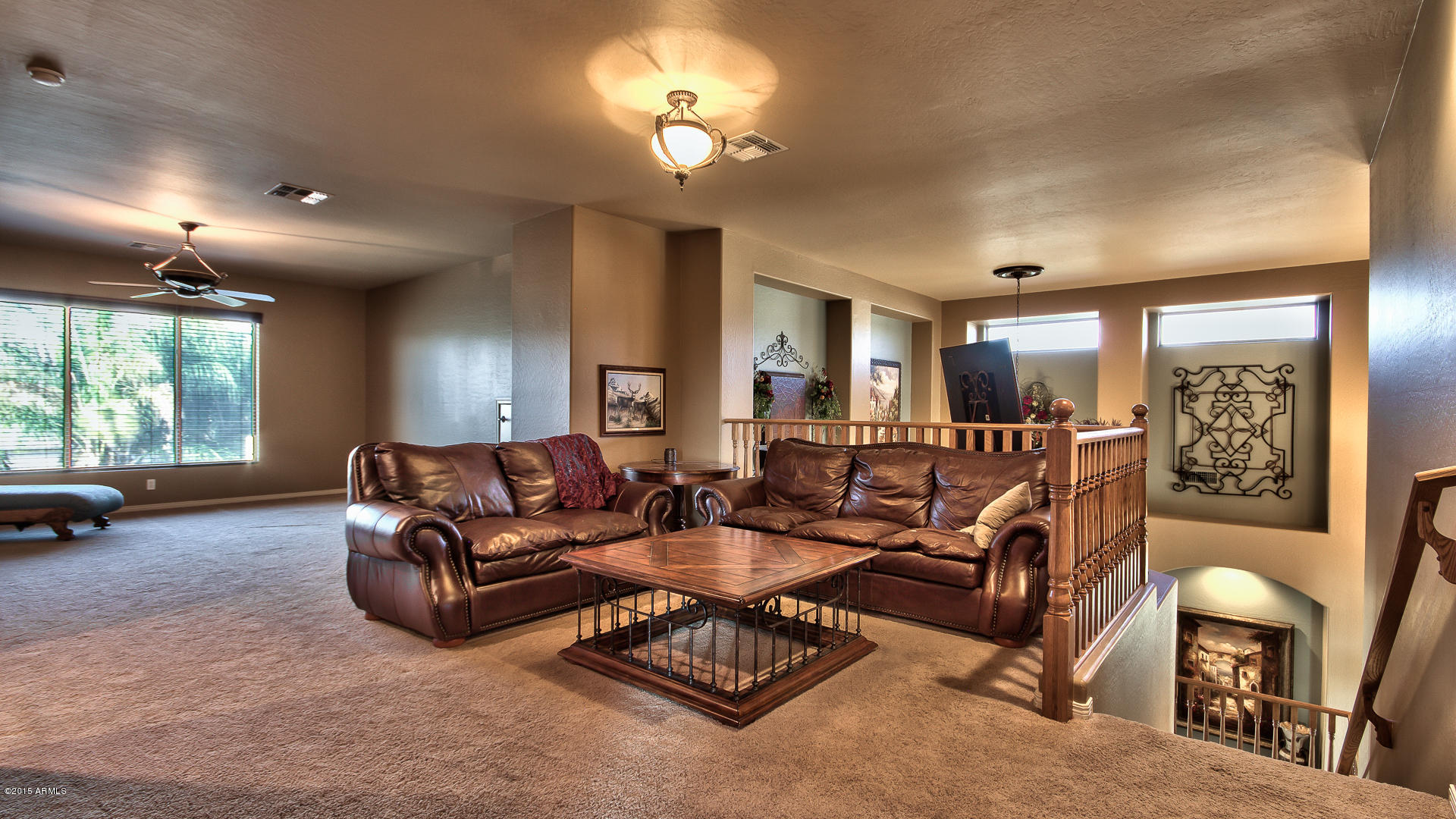 4782 East Buckboard Road Gilbert, AZ 85297 - Photo 24 of 57 a living room with furniture and a large window