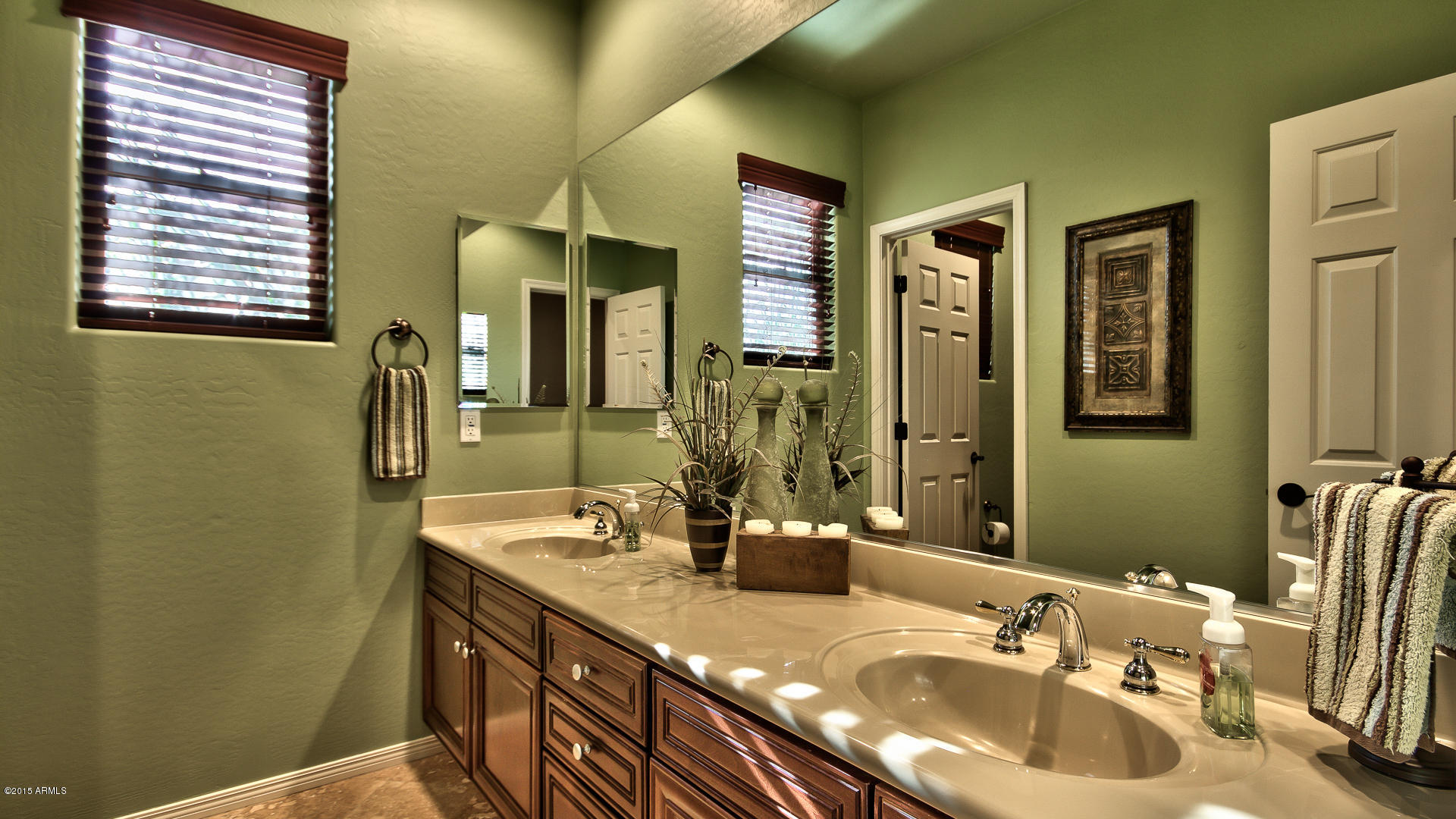 4782 East Buckboard Road Gilbert, AZ 85297 - Photo 30 of 57 a bathroom with double vanity sink and a mirror