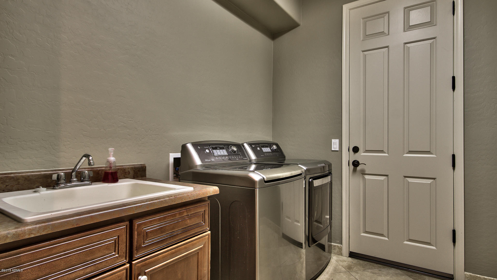 4782 East Buckboard Road Gilbert, AZ 85297 - Photo 31 of 57 a utility room with dryer and washer