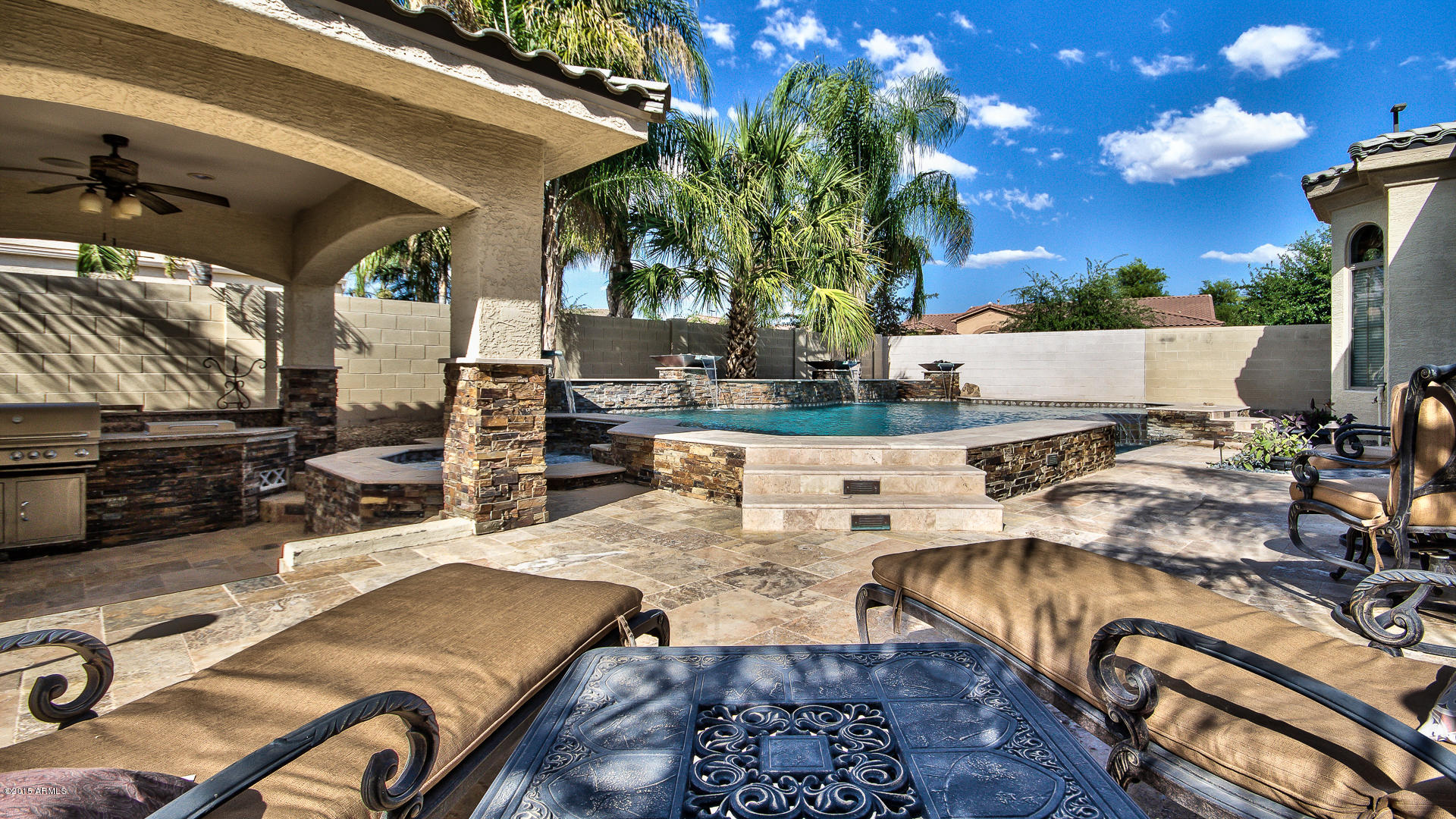 4782 East Buckboard Road Gilbert, AZ 85297 - Photo 32 of 57 a view of a patio with swimming pool