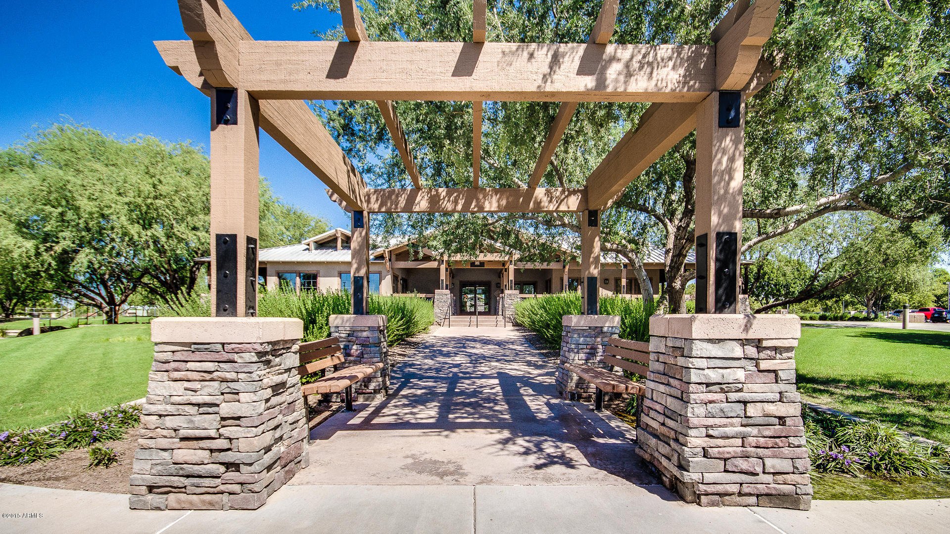 4782 East Buckboard Road Gilbert, AZ 85297 - Photo 47 of 57 a view of a patio with table and chairs potted plants and a large tree