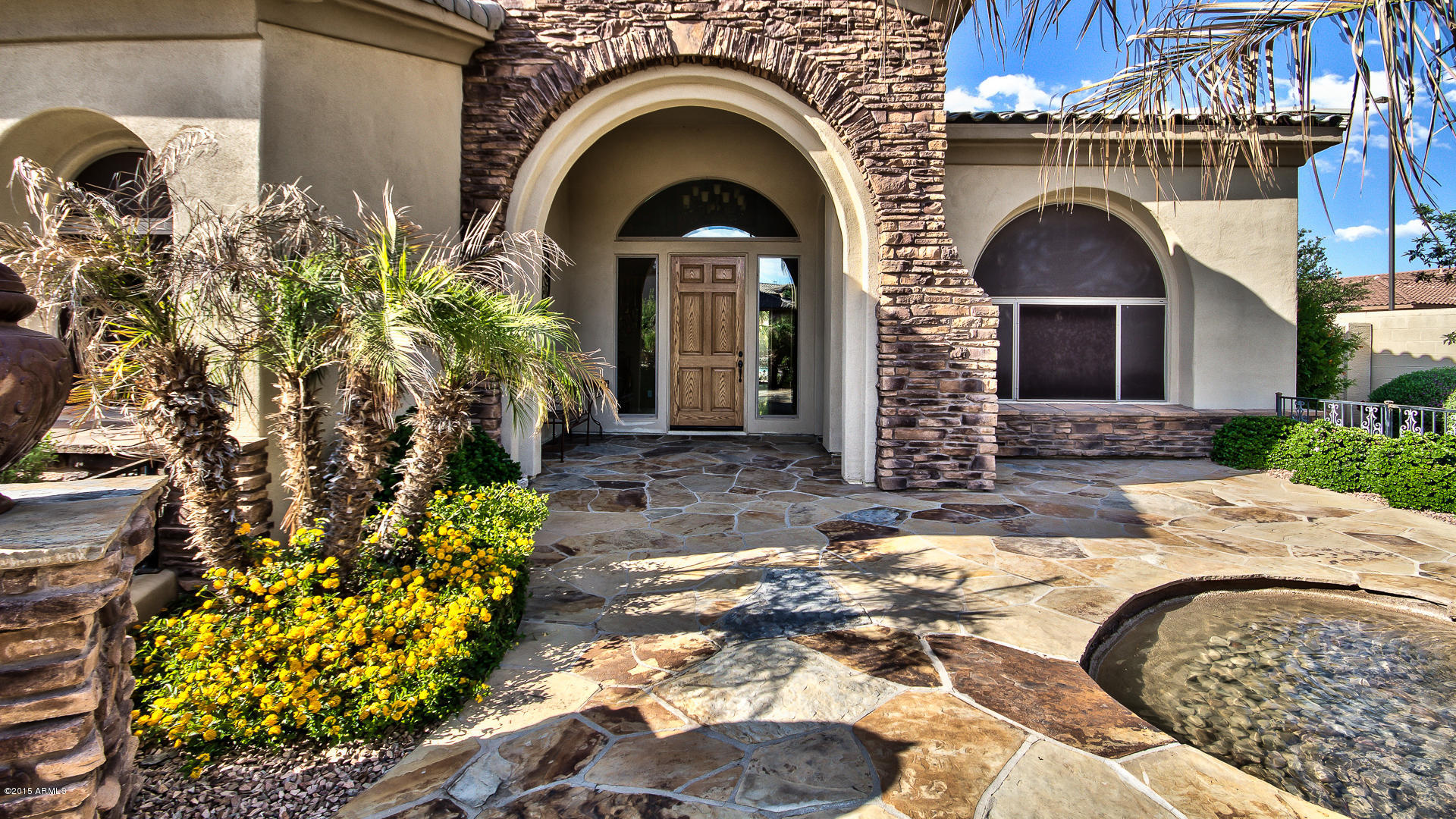 4782 East Buckboard Road Gilbert, AZ 85297 - Photo 5 of 57 a front view of a house with a garden