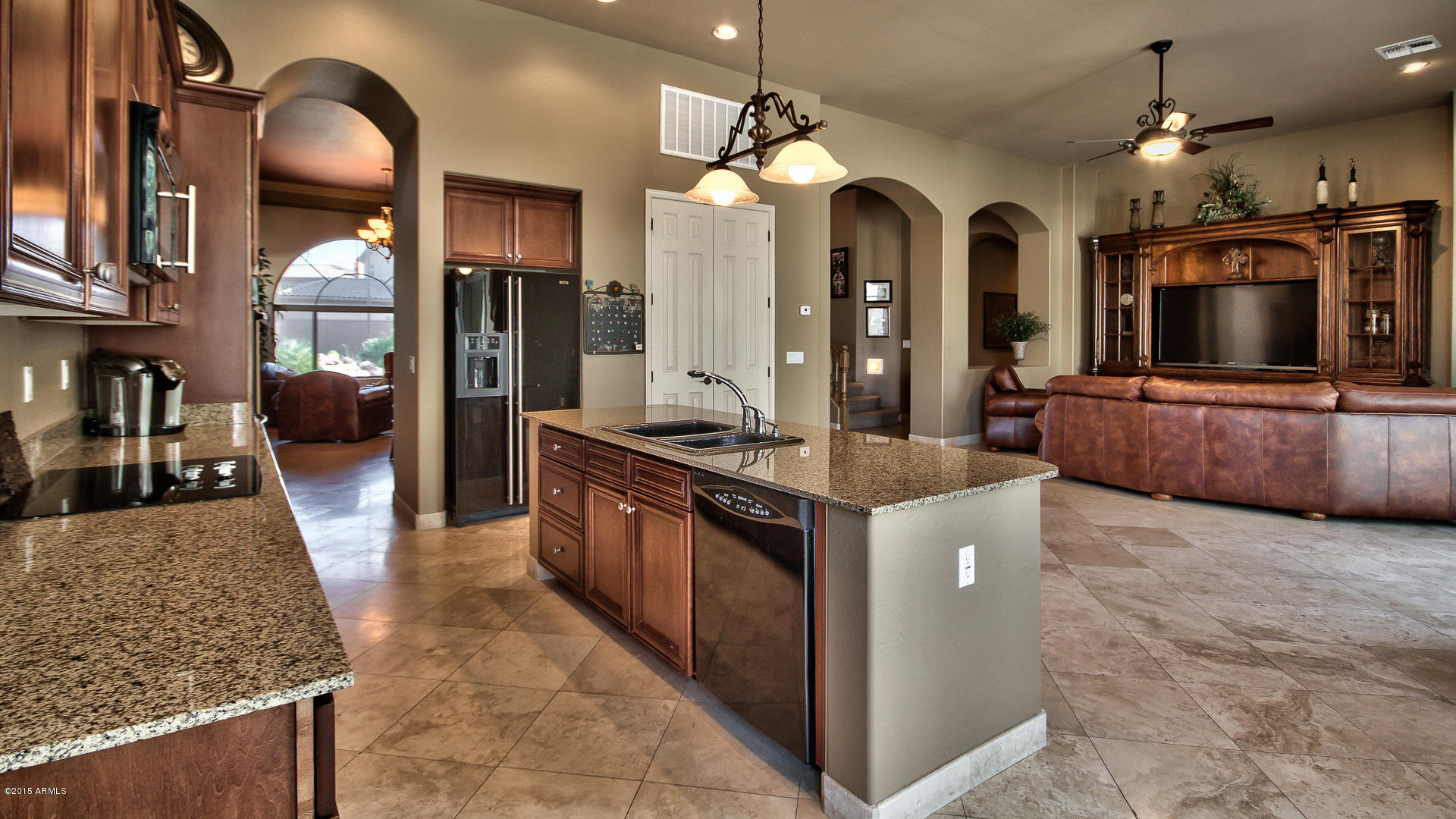 4782 East Buckboard Road Gilbert, AZ 85297 - Photo 10 of 57 a large kitchen with stainless steel appliances granite countertop a large counter top and stove