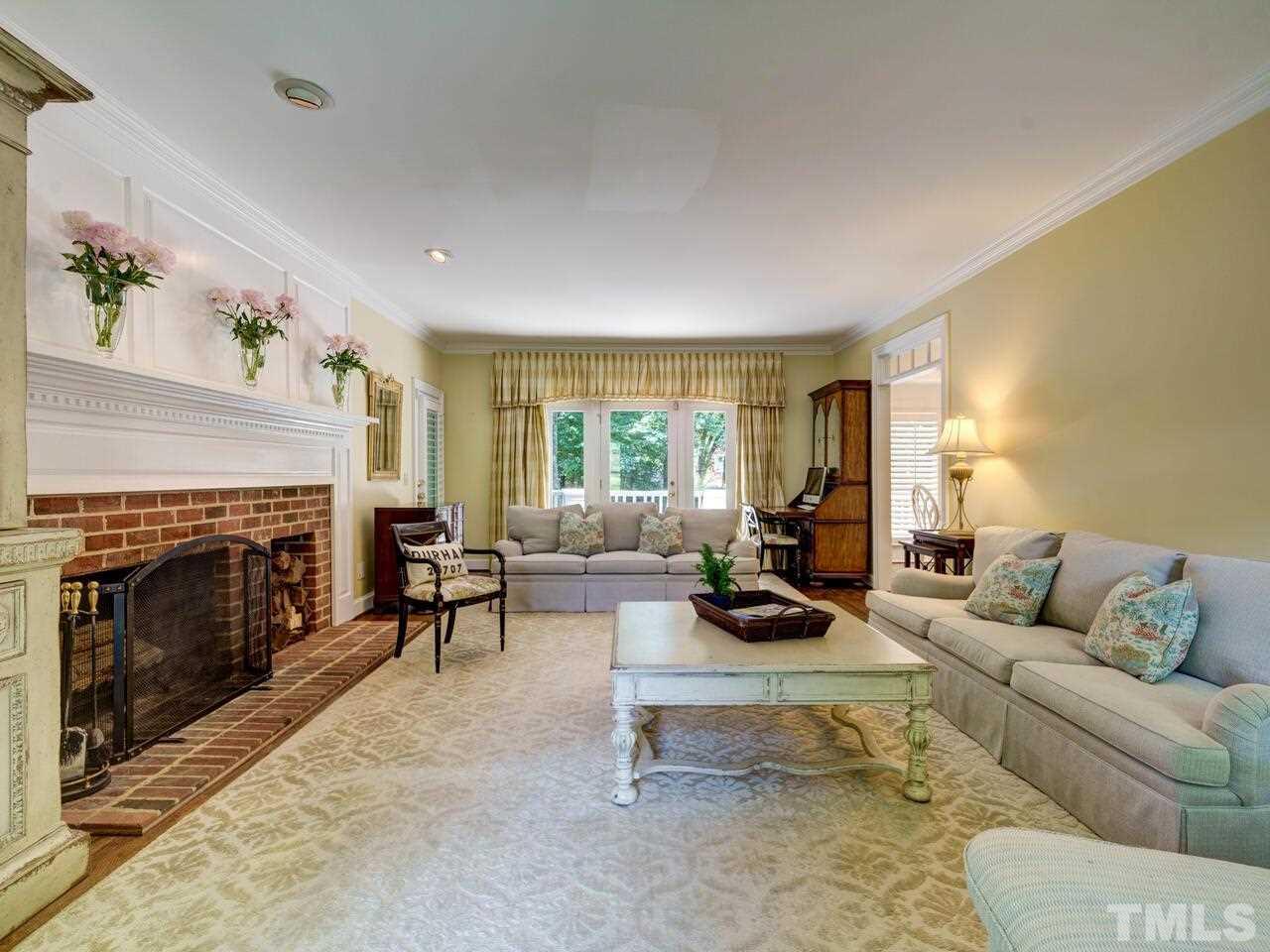 4113 Colville Road Durham, NC 27707 - Photo 13 of 30 Wood-burning fireplace and built-in log bin.