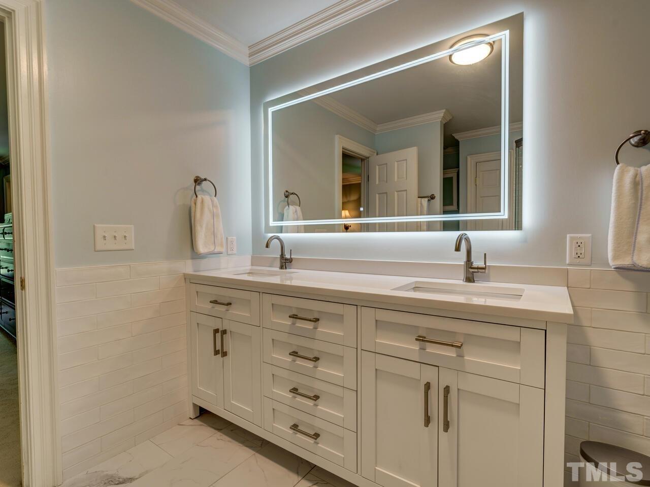 4113 Colville Road Durham, NC 27707 - Photo 19 of 30 Backlit mirror provides a touch of elegance.