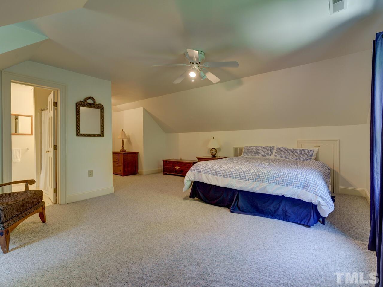 4113 Colville Road Durham, NC 27707 - Photo 24 of 30 Fifth Bedroom/Bonus Room is on the third floor and has its own full bath. Walk-in attic is at other end of the stairway.
