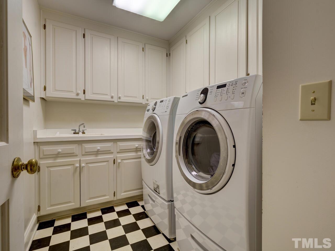 4113 Colville Road Durham, NC 27707 - Photo 26 of 30 Located beside the Master Bedroom is full laundry with sink.