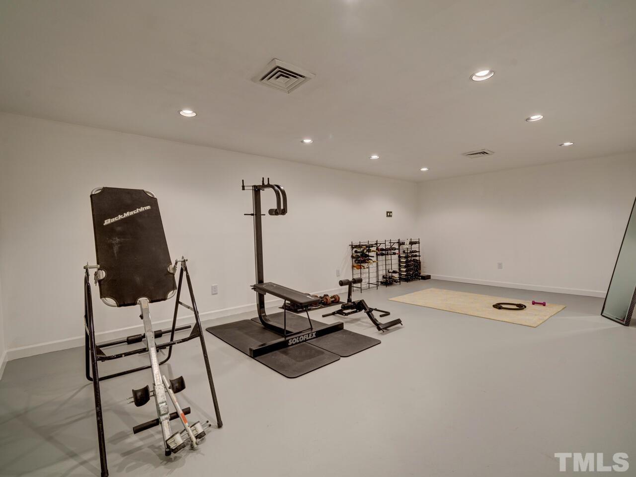 4113 Colville Road Durham, NC 27707 - Photo 28 of 30 This heated and air-conditioned room is located on the lower level. Originally built as a wine cellar, it functions as an at-home fitness room.