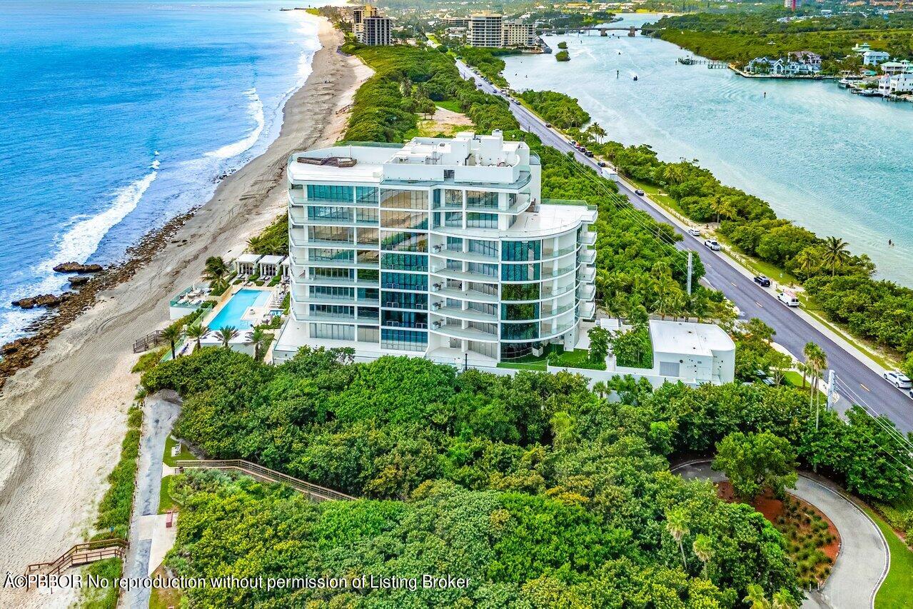 1500 South Beach Road, Unit 301 Tequesta, FL 33469 - Photo 20 of 28 an aerial view of a residential apartment building with a yard