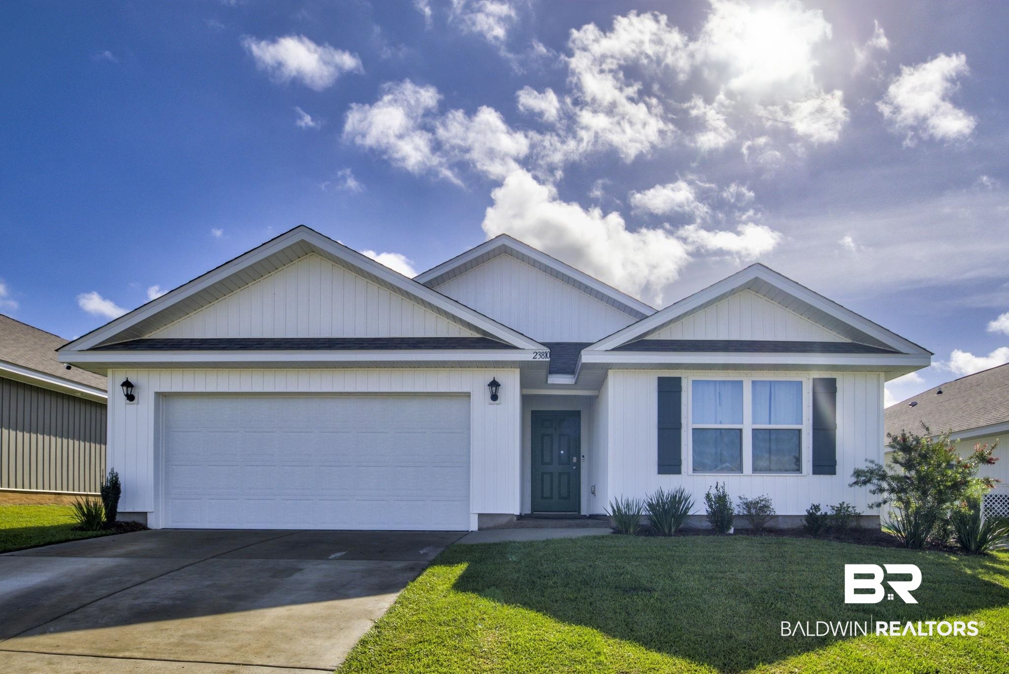 23810 Unbridled Loop Daphne, AL 36526 - Photo 1 of 50 View of front of property with a front lawn and a garage