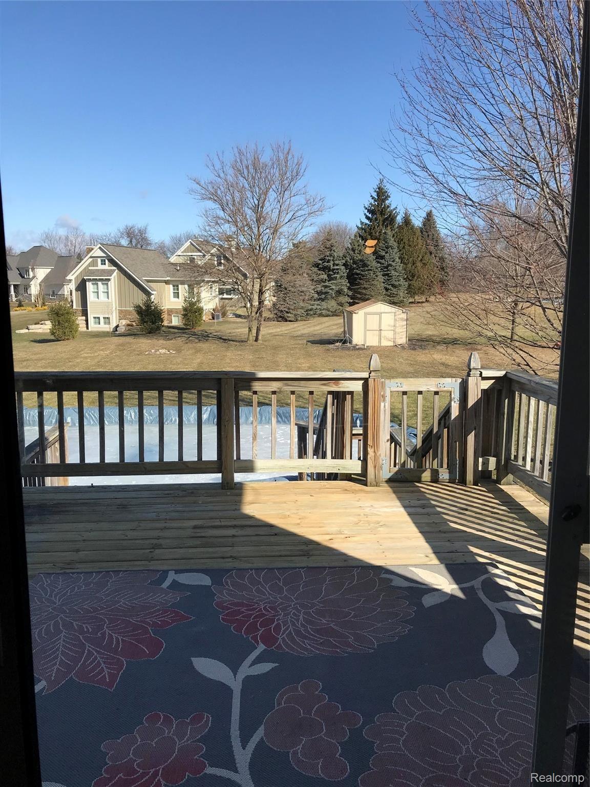 275 East Rolston Road Linden, MI 48451 - Photo 19 of 28 Deck - Pool - Shed