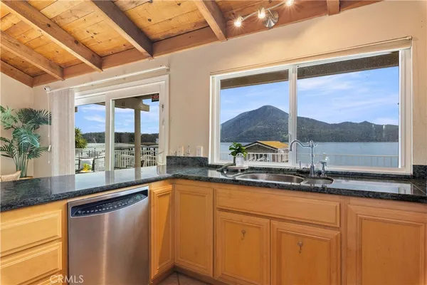 a kitchen with a sink and large window