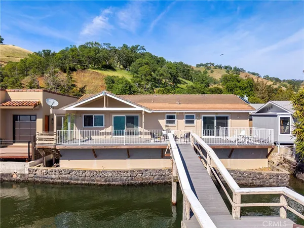 a house with swimming pool in front of it