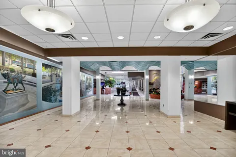 a view of a hallway with furniture