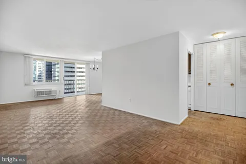 a view of an empty room with a window