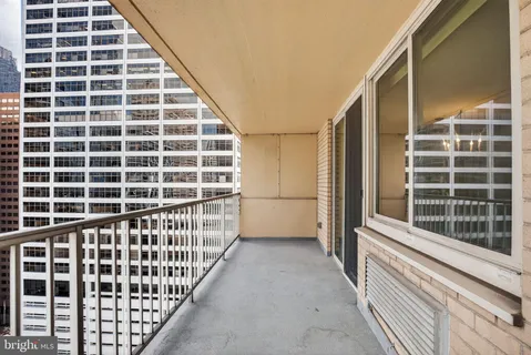 a view of a balcony with staircase
