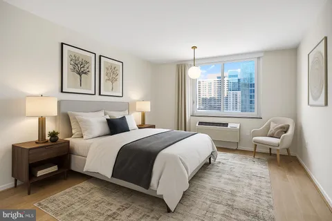 a bedroom with bed and a couch