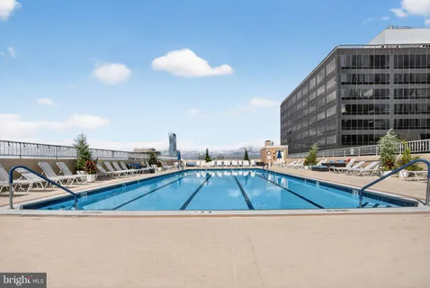 a view of a swimming pool with a lounge chair