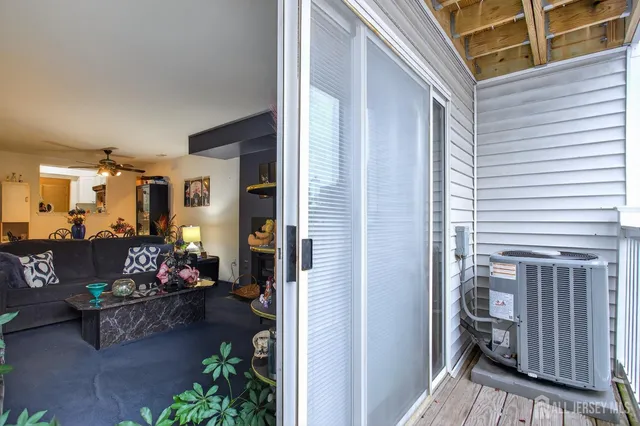 a bedroom with a bed a dresser and a window