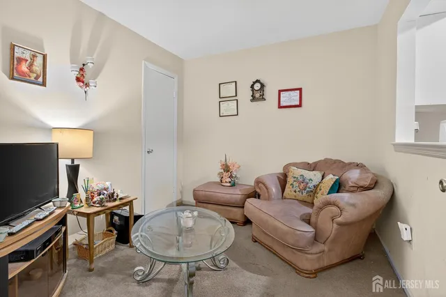 a bathroom with a sink and mirror with bathtub