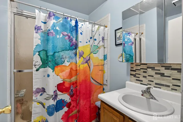 a bathroom with a sink and mirror